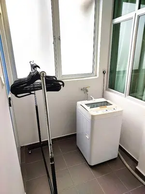 a bathroom with a sink and a washing machine at SR28-HousePrivate-3room-BigHouse in Bayan Lepas