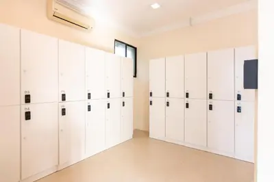 a large white locker room with white lockers at Momostay in George Town