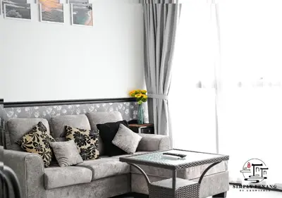 a living room with a couch and a table at Urban Suites by Simply Penang in Jelutong