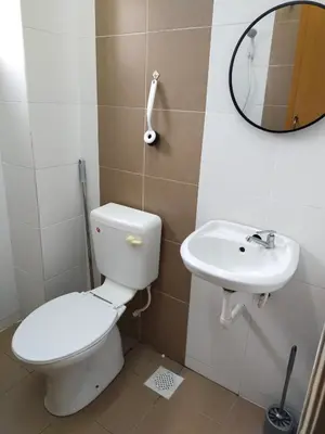 a bathroom with a toilet and a sink at WAFID HOMESTAY 2 SERI ISKANDAR in Seri Iskandar