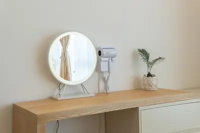 a mirror on top of a counter in a room at Serene Muji Family Cottage(2-7pax) & Sunrise View in Cameron Highlands