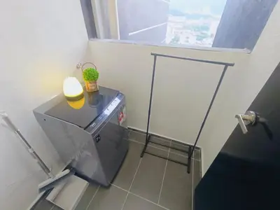 a washing machine in a bathroom with a window at Infinity Pool, Georgetown, Up to 11 Pax, 2 Bedrooms, 2 Bathrooms, 2 Car Parks by Star Home in Jelutong