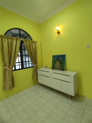 a yellow room with a dresser and a window at Ipoh Tambun Sunway 5 Rooms Spacious Homestay in Tambun