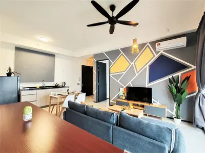 a living room with a couch and a ceiling fan at Modern Elegance Suite, 5 to 6 pax at Urban Suites Georgetown by SuperStay in Jelutong
