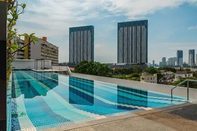 a large swimming pool on the roof of a building at Deluxe Seaview Suite Twin Bed by The Only Bnb in Tanjong Tokong