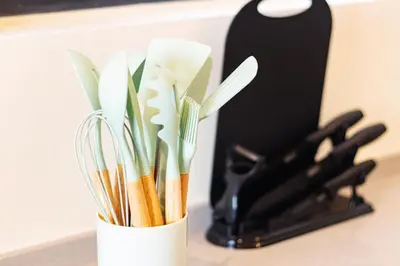 a white container filled with utensils on a counter at Urban Suites, Signature Collection by Stellar ALV in Jelutong