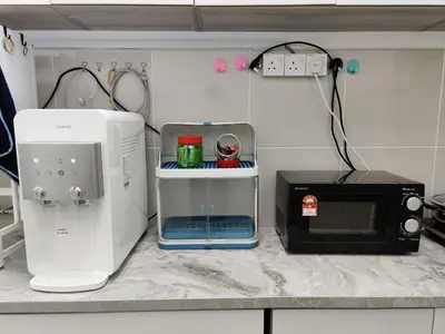 a kitchen counter with a microwave and a toaster at Hygge Living Kampar II (Near UTAR) in Kampar