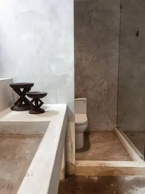 a bathroom with a toilet and a sink and a shower at Heritage Boutique Home in George Town