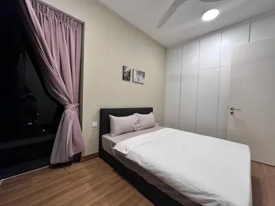 a bedroom with a white bed and a window at Tropicana 218 Macalister WL in George Town