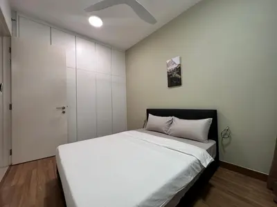 a bedroom with a white bed and a white closet at Tropicana 218 Macalister WL in George Town