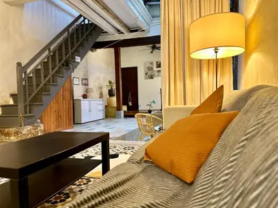 a living room with a couch and a table at (New) Eternal Granpa’s heritage(UNESCO)/11pax/3BR in George Town