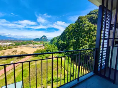a balcony with a view of a mountain at Hygge Living@Sunway Onsen in Tambun