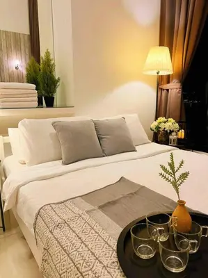 a bedroom with a bed with a tray on it at [NEW LAUNCH] SUNRISE GURNEY SEAVIEW'63 无敌日出海景63 in George Town