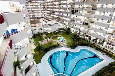 an aerial view of an apartment complex with a swimming pool at Georgetown, Up to 6 Pax, 3 Bedrooms, 1 Car Park by Star Home in Jelutong