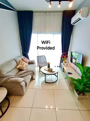 a living room with a couch and a table at The Horizon Ipoh L8 by Grab A Stay in Ipoh