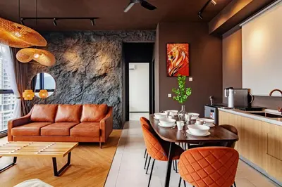 a living room with a table and a couch at Urban Suites, Spectre Collection by Stellar ALV in Jelutong