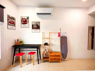 a room with a table and two red stools at Ipoh Manhattan Waterpark View 3BR Condo by City Home Empire MHD704 in Ipoh