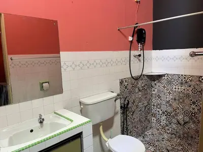 a bathroom with a toilet and a sink and a shower at Wi-Fi 100MB Free Ipoh Happy Big House SemiD TH24 16 pax in Ipoh