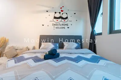 a bedroom with a bed with a teddy bear on it at Comfy Studio Room by Moowin in Perai