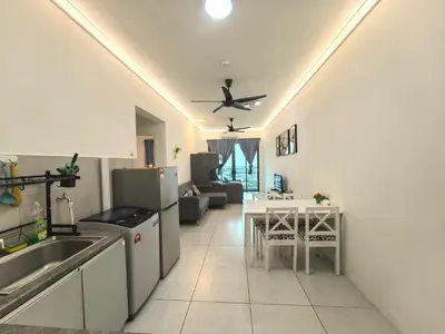 a kitchen and living room with a ceiling fan at Summer Cozy Big Studio in Perai