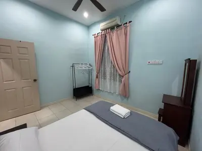 a bedroom with a bed and a window and a door at JZ at Sungai Besar Single Storey Semi-D in Sungai Besar