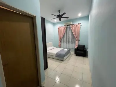 a bedroom with a bed and a ceiling fan at JZ at Sungai Besar Single Storey Semi-D in Sungai Besar