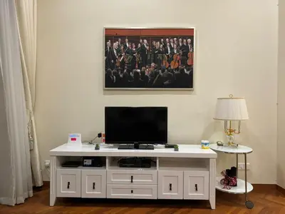 a white entertainment center with a television on top of it at Perfect Marina @ Strait Quay /w Exclusive Stay in Tanjong Tokong