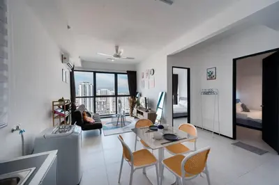 a living room with a table and chairs at NEW Infinity Pool Seaview Urban Suite #2Carparks #2BR 23a5 in Jelutong
