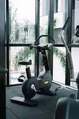 a gym with a exercise bike in front of a window at NEW Infinity Pool Seaview Urban Suite #2Carparks #2BR 23a5 in Jelutong