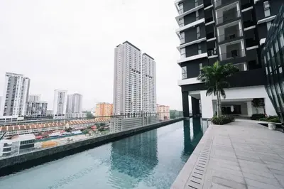 a swimming pool on the side of a building at NEW Infinity Pool Seaview Urban Suite #2Carparks #2BR 23a5 in Jelutong