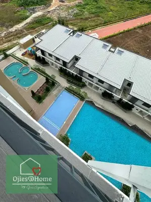 an overhead view of a building with two swimming pools at Ojieshome 1BR Sunway Onsen Tambun in Tambun