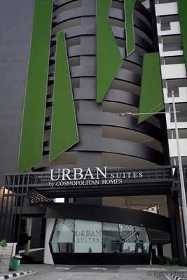 a building with a large green sign on it at Urban Suites Homestay by Vista Vibes in Jelutong
