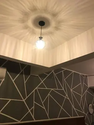 a ceiling with a light in a room at Pangkor BeachWalk Studio in Pangkor
