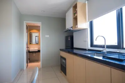 a kitchen with a sink and a counter top at Zenstay Abnb Perai Penang in Bukit Mertajam