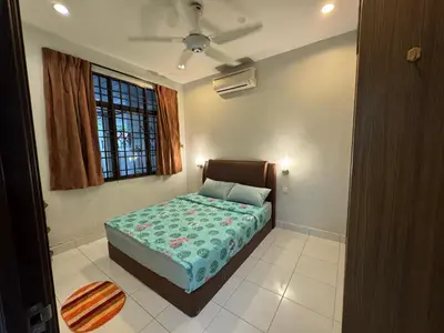 a bedroom with a bed and a window at Cozy House 37 @ Alma BM in Bukit Mertajam