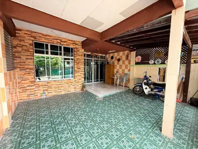 a room with a motorcycle parked on a tile floor at Wan Homestay Kulim Hi-Tech Mslliim only in Kulim