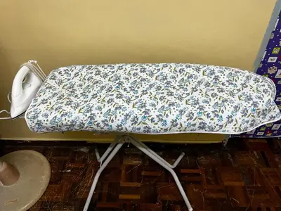 a bed in a room with a sheet on it at Wan Homestay Kulim Hi-Tech Mslliim only in Kulim