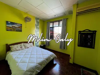 a bedroom with a bed and a sign that reads millinicky at Wan Homestay Kulim Hi-Tech Mslliim only in Kulim