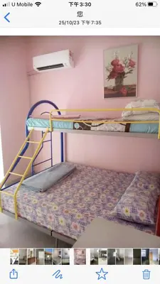 a bedroom with two bunk beds in a room at Batu Kawan HS in Simpang Ampat