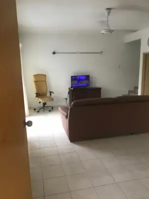 a living room with a couch and a chair at Batu Kawan HS in Simpang Ampat