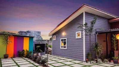 a small house with a rainbow at Hidden 5BR Cottage House Retreats (Free Parking) in Butterworth
