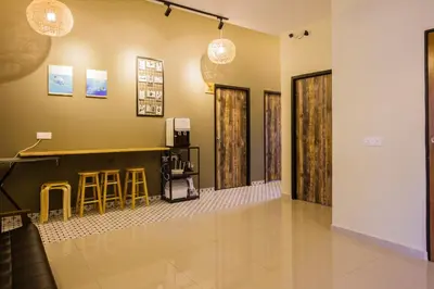 a lobby with a bar and some stools at Hidden 5BR Cottage House Retreats (Free Parking) in Butterworth