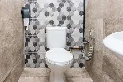 a bathroom with a toilet and a sink at Hidden 4BR Cottage House Retreats (Free Parking) in Butterworth