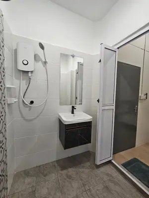 a white bathroom with a sink and a shower at Summer Home 15 Georgetown Adventist in George Town