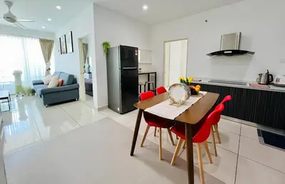 a kitchen and dining room with a table and red chairs at Mansion One l 7pax 2R2B l Seaview l Gleneagle l by PerfectSweetHome in George Town