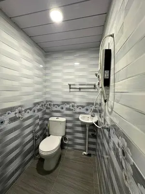a bathroom with a toilet and a sink at Shan Homestay in Sungai Petani