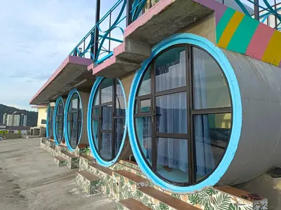 a row of windows on the side of a building at Cameron Highlands Blueberry Earth House in Cameron Highlands