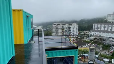a balcony of a building with a view of a city at Cameron Highlands Blueberry Earth House in Cameron Highlands