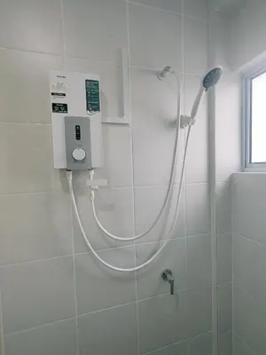 a shower with a hose in a bathroom at Cozy Home Kampar (UTAR) 5bedrooms 10pax Free WiFi in Kampar