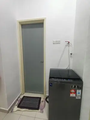 a door leading into a room with a stove at HOMESTAY BERTAM SAFAR in Kepala Batas